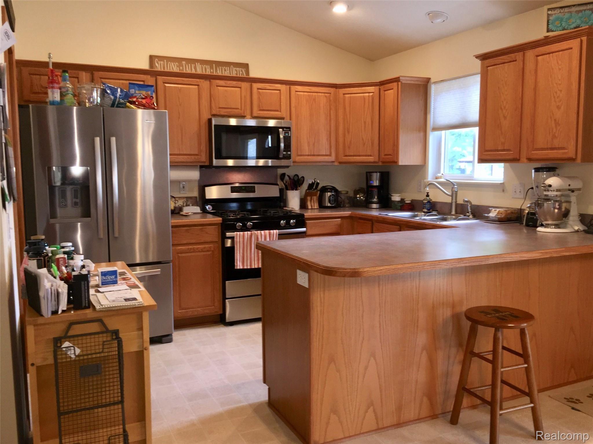 7047 Gillette Road Flushing, MI 48433 - Photo 10 of 38 Open kitchen comes with ALL the appliances. (approximately two years old)