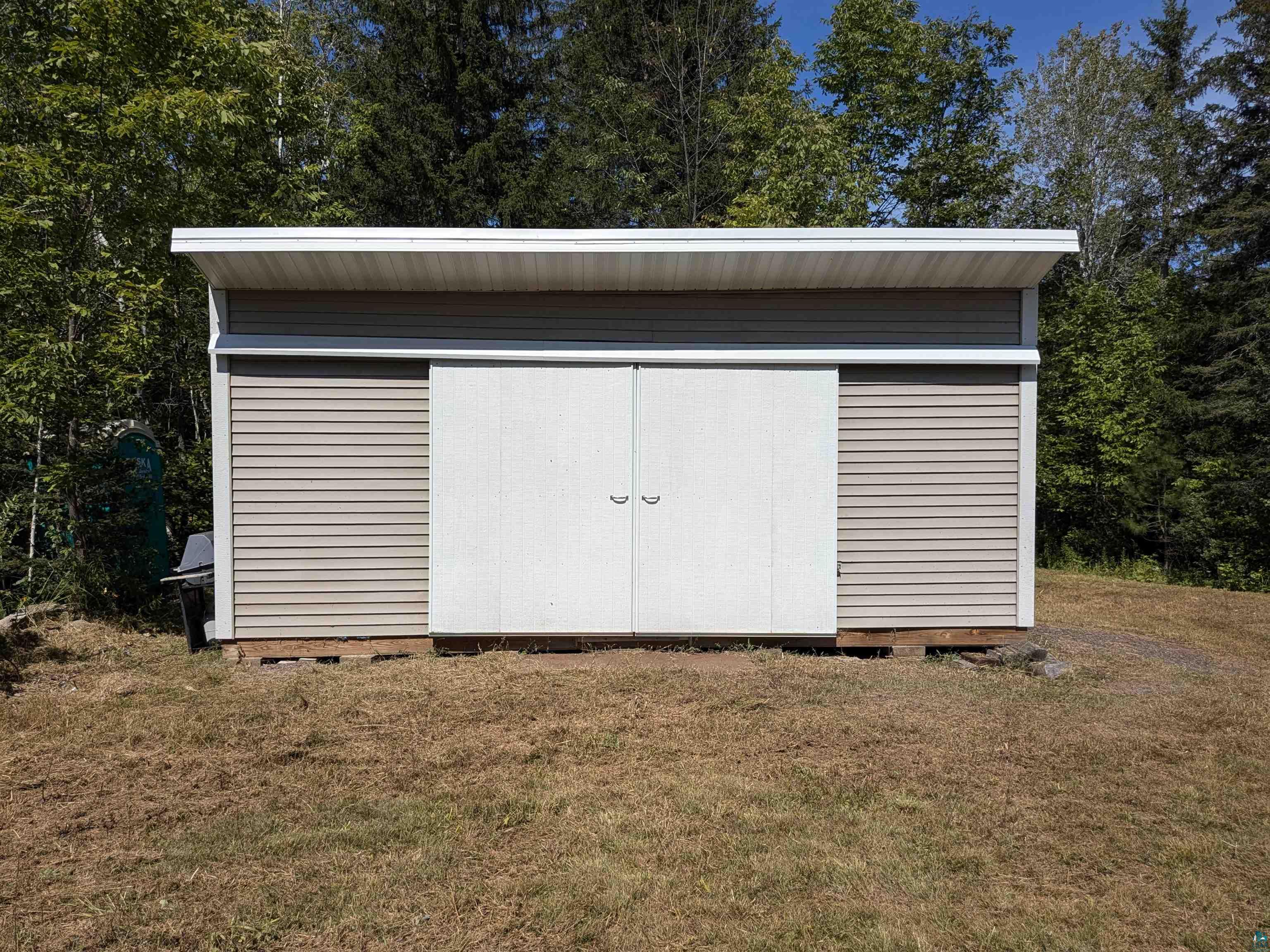 7163 W Highway 2 Hurley, WI 54534 - Photo 5 of 13 View of outbuilding featuring a lawn