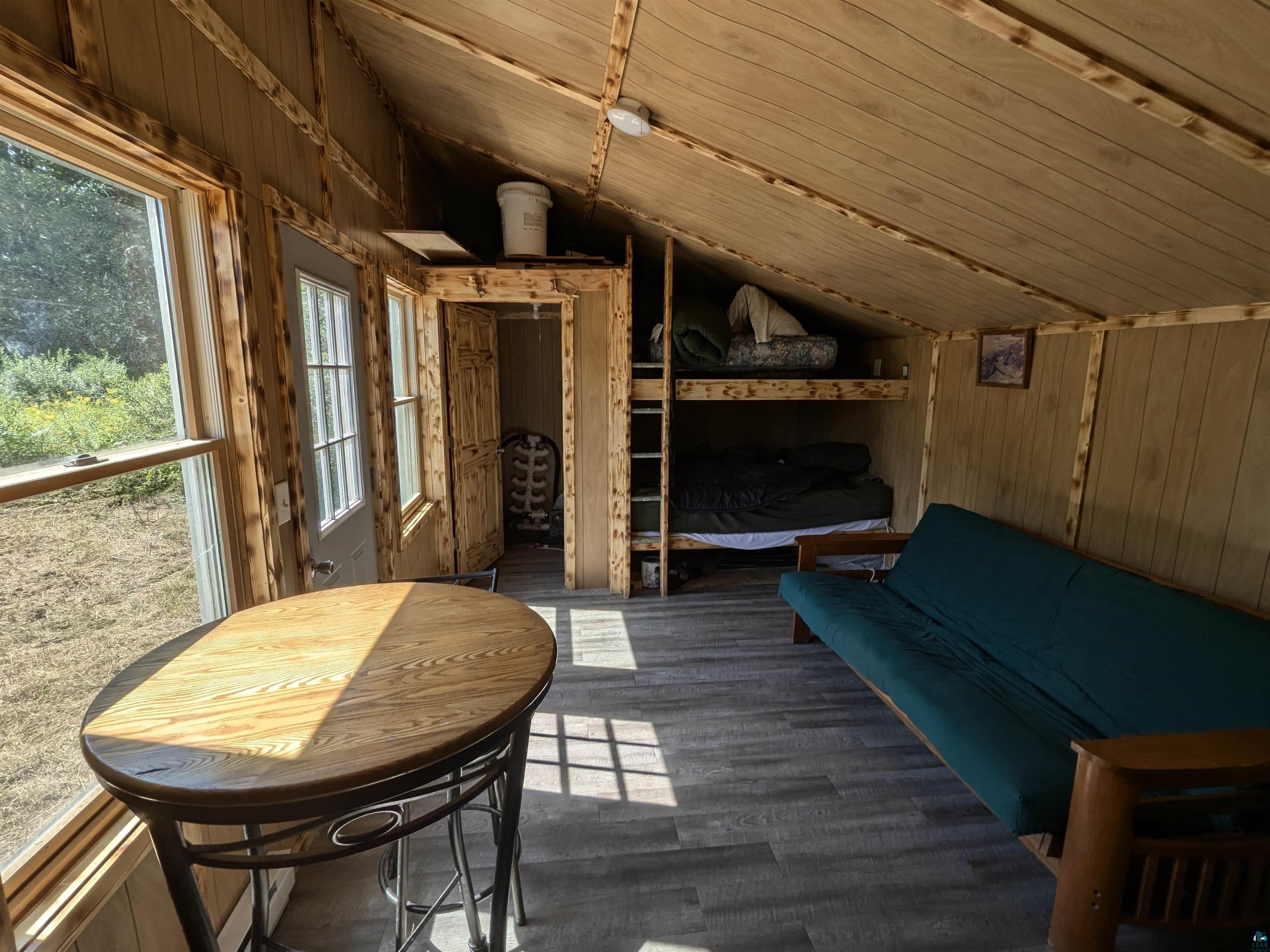 7163 W Highway 2 Hurley, WI 54534 - Photo 8 of 13 Sunroom / solarium featuring wood ceiling and lofted ceiling