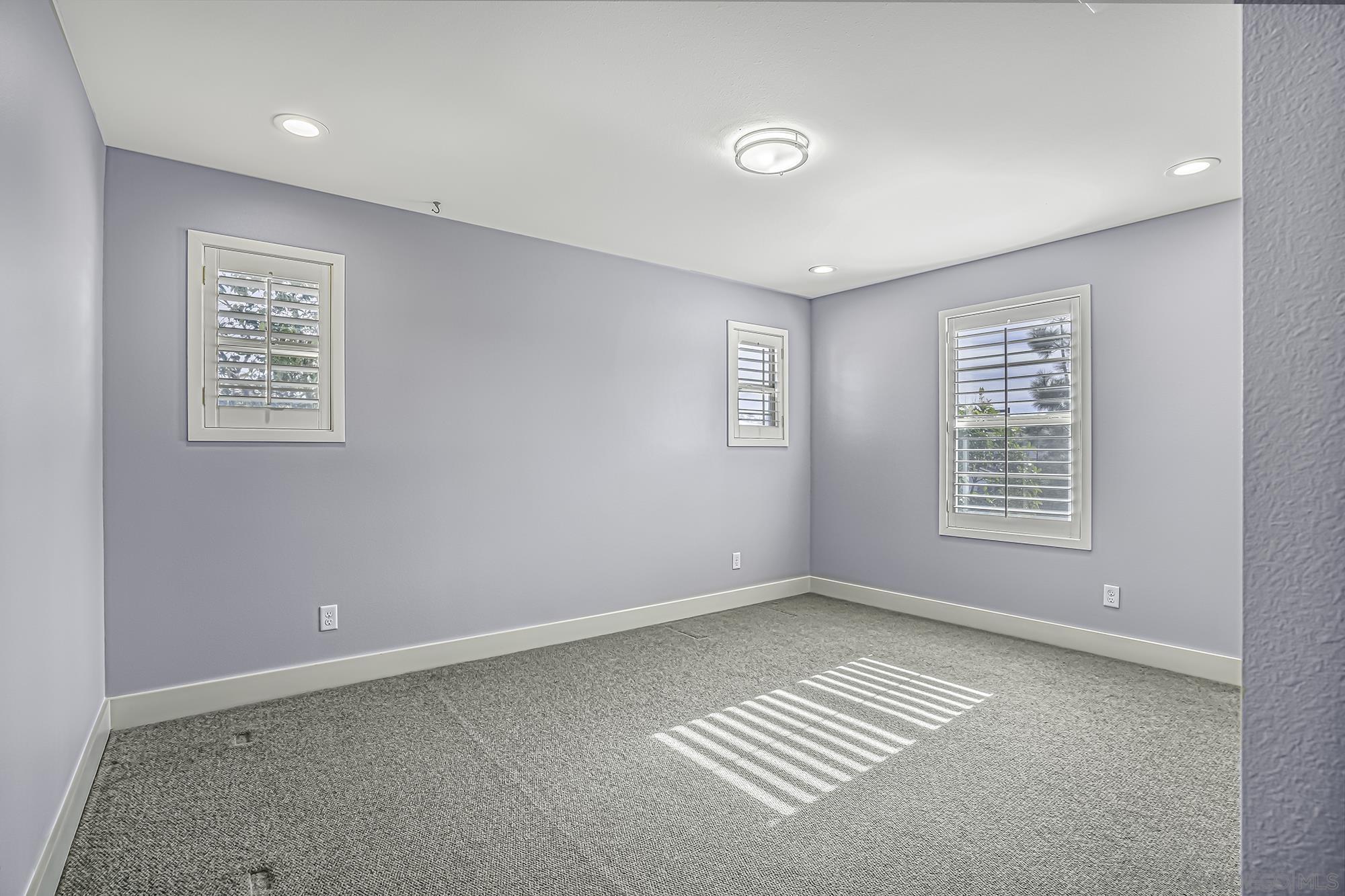 145 Stonesteps Way Encinitas, CA 92024 - Photo 13 of 25 a view of an empty room with a window