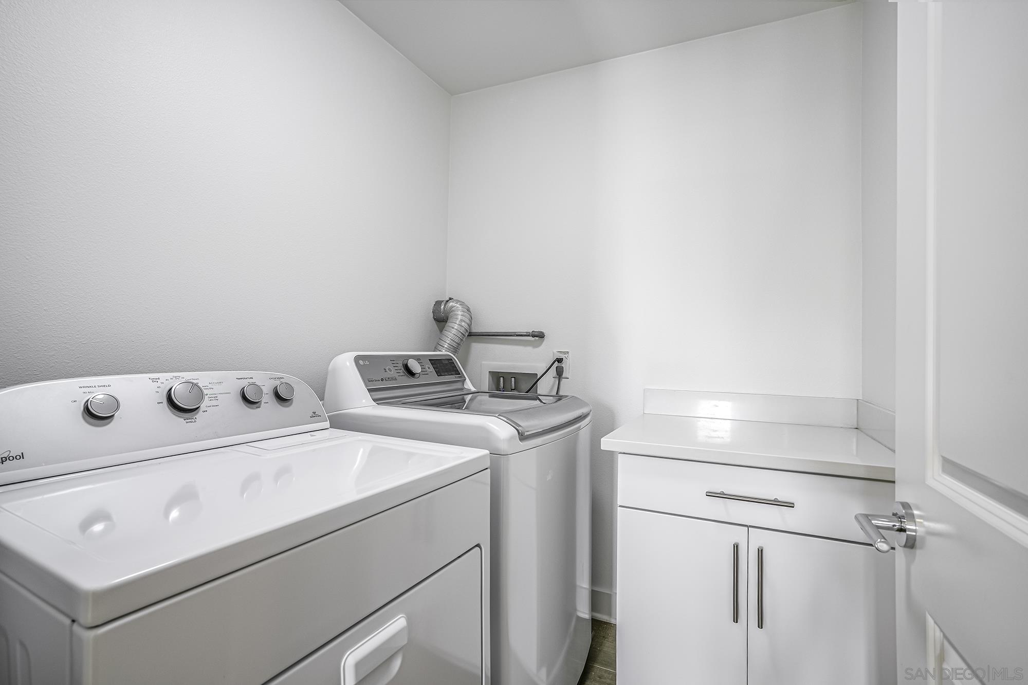145 Stonesteps Way Encinitas, CA 92024 - Photo 17 of 25 a utility room with dryer and washer