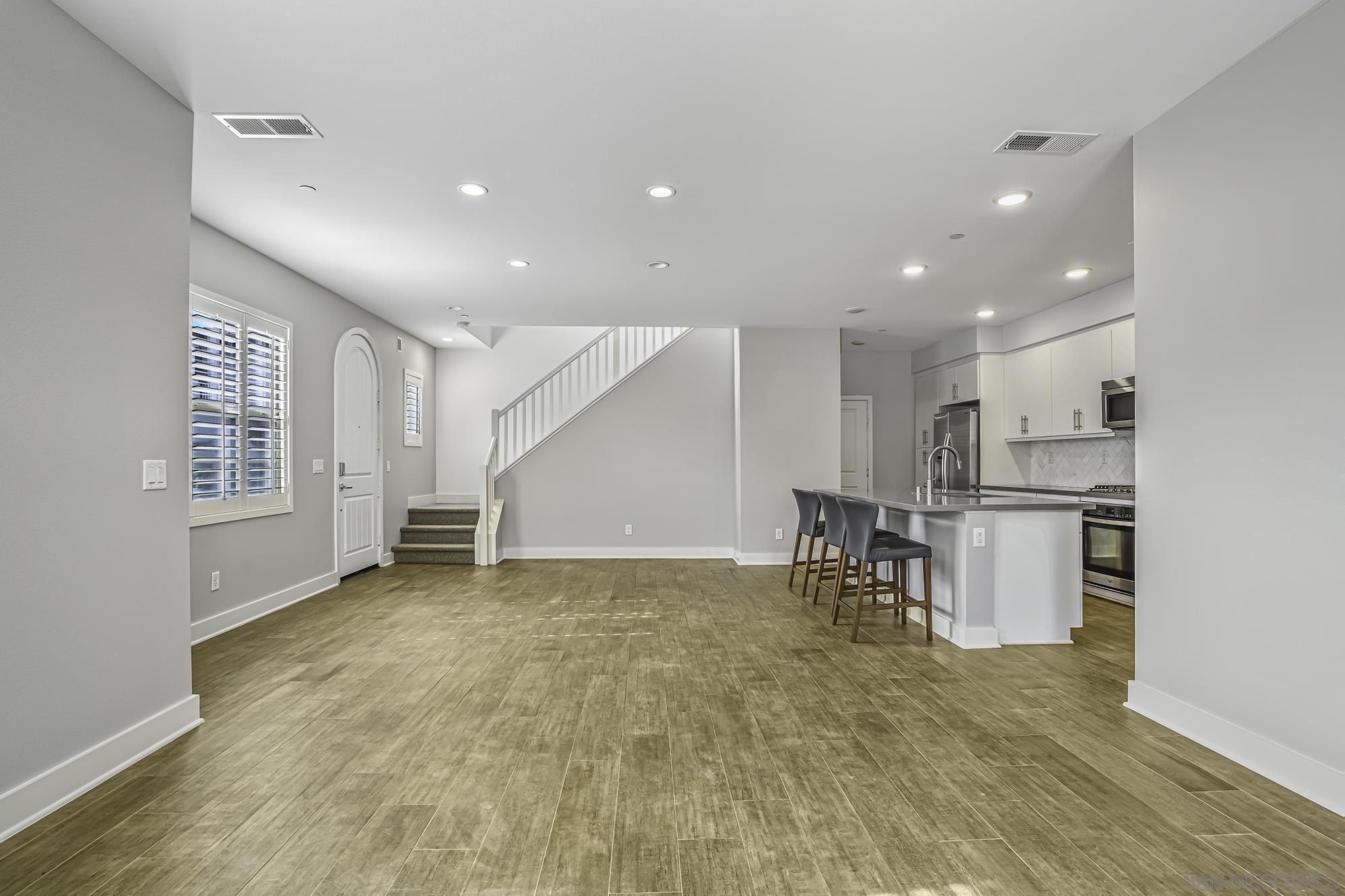 145 Stonesteps Way Encinitas, CA 92024 - Photo 4 of 25 a view of kitchen with furniture and refrigerator