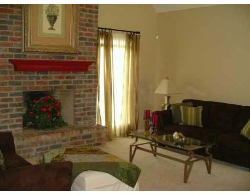 201 Cypress Point Road Portland, TX 78374 - Photo 2 of 6 a living room with furniture and a fireplace