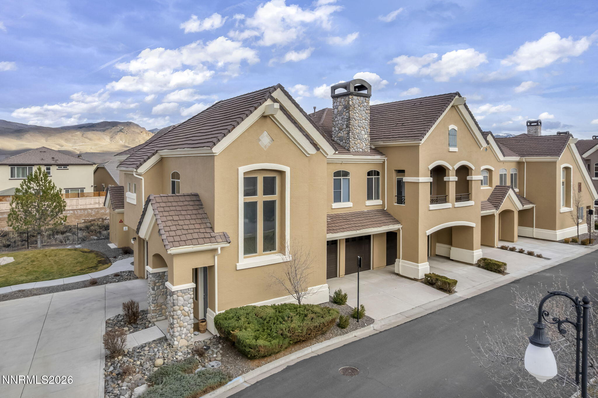 9900 Wilbur May Parkway, Unit 2405 Reno, NV 89521 - Photo 11 of 81 a front view of a house with garden
