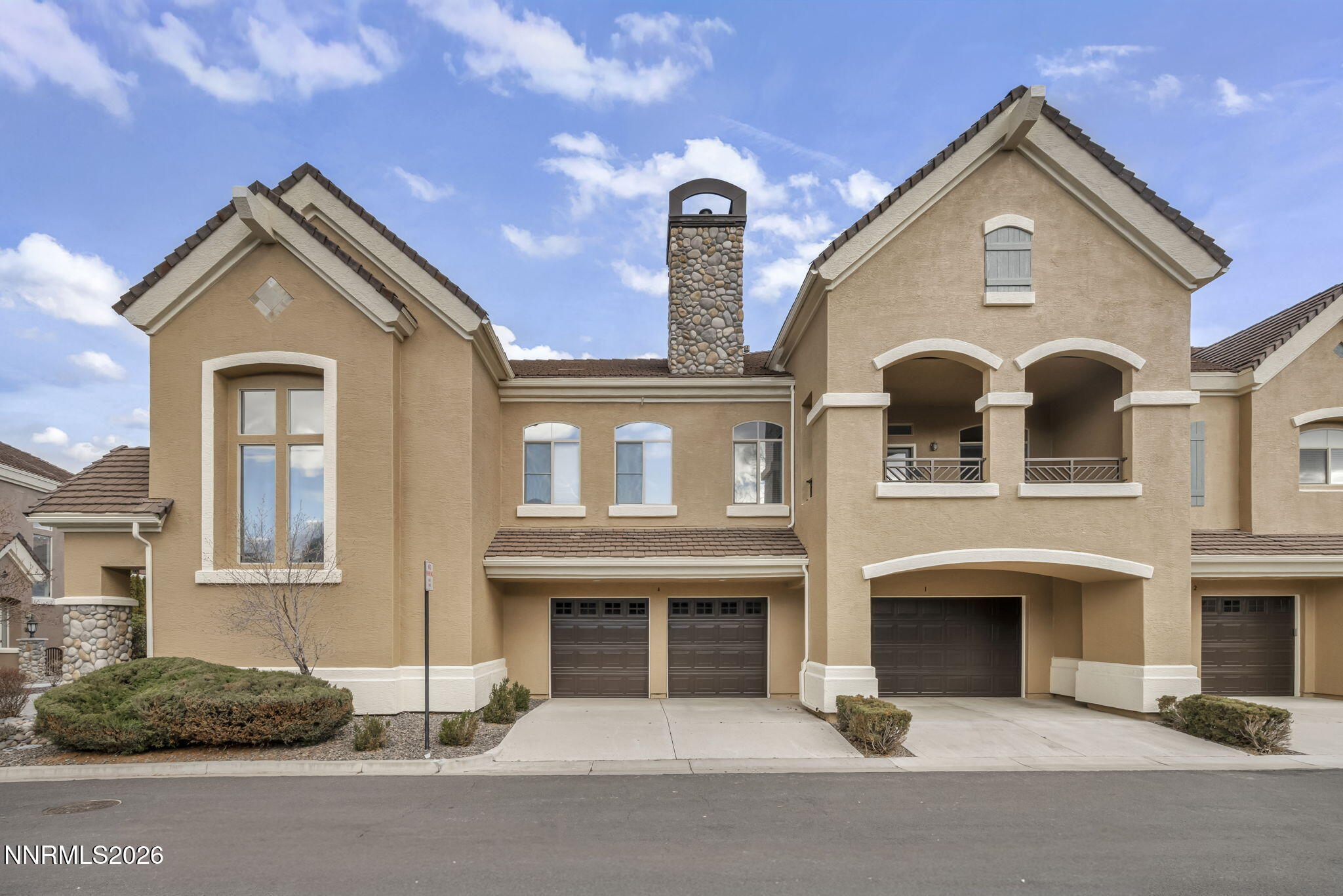 9900 Wilbur May Parkway, Unit 2405 Reno, NV 89521 - Photo 2 of 81 a front view of a house with a yard