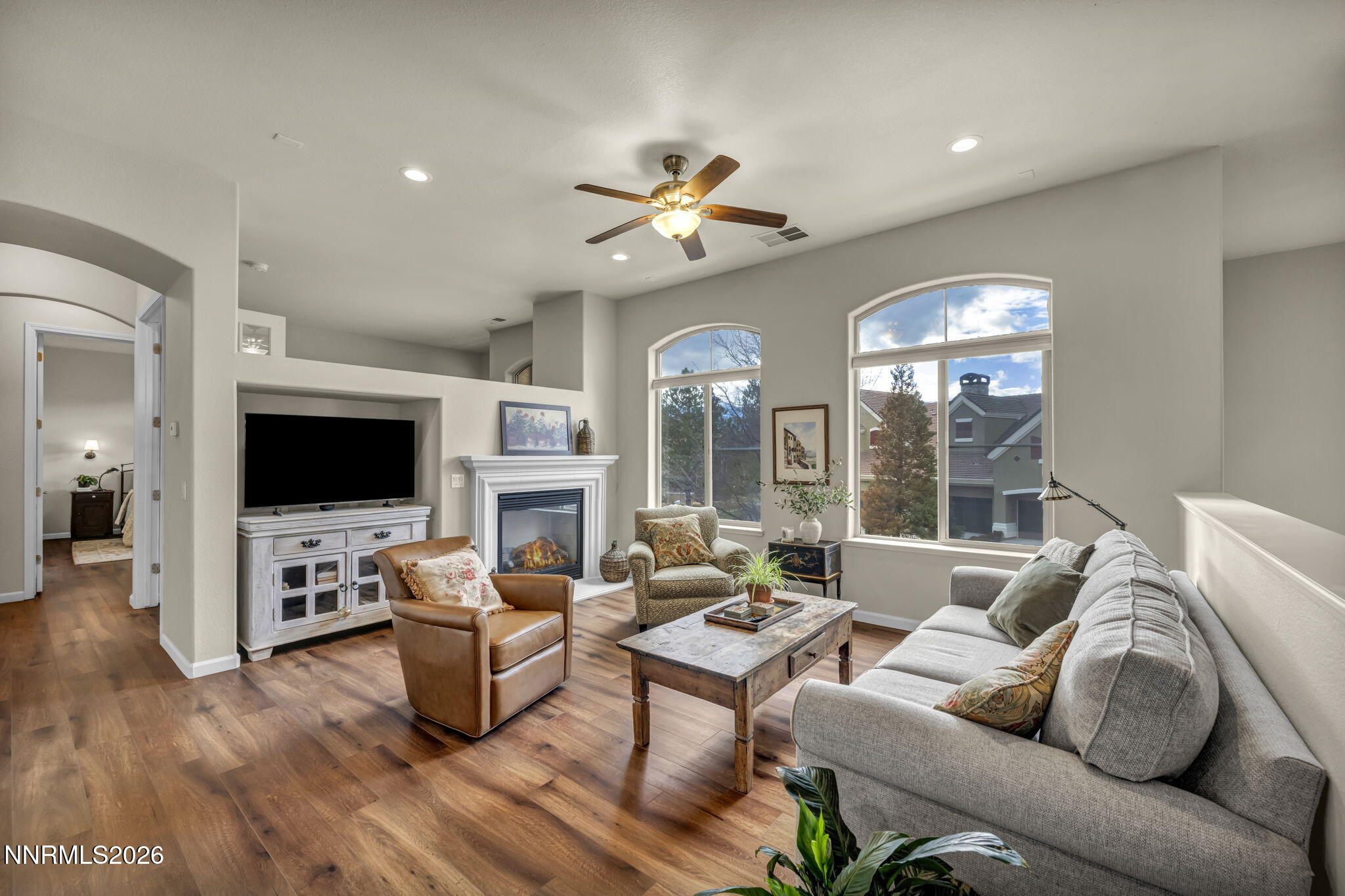 9900 Wilbur May Parkway, Unit 2405 Reno, NV 89521 - Photo 23 of 81 a living room with furniture fireplace and flat screen tv