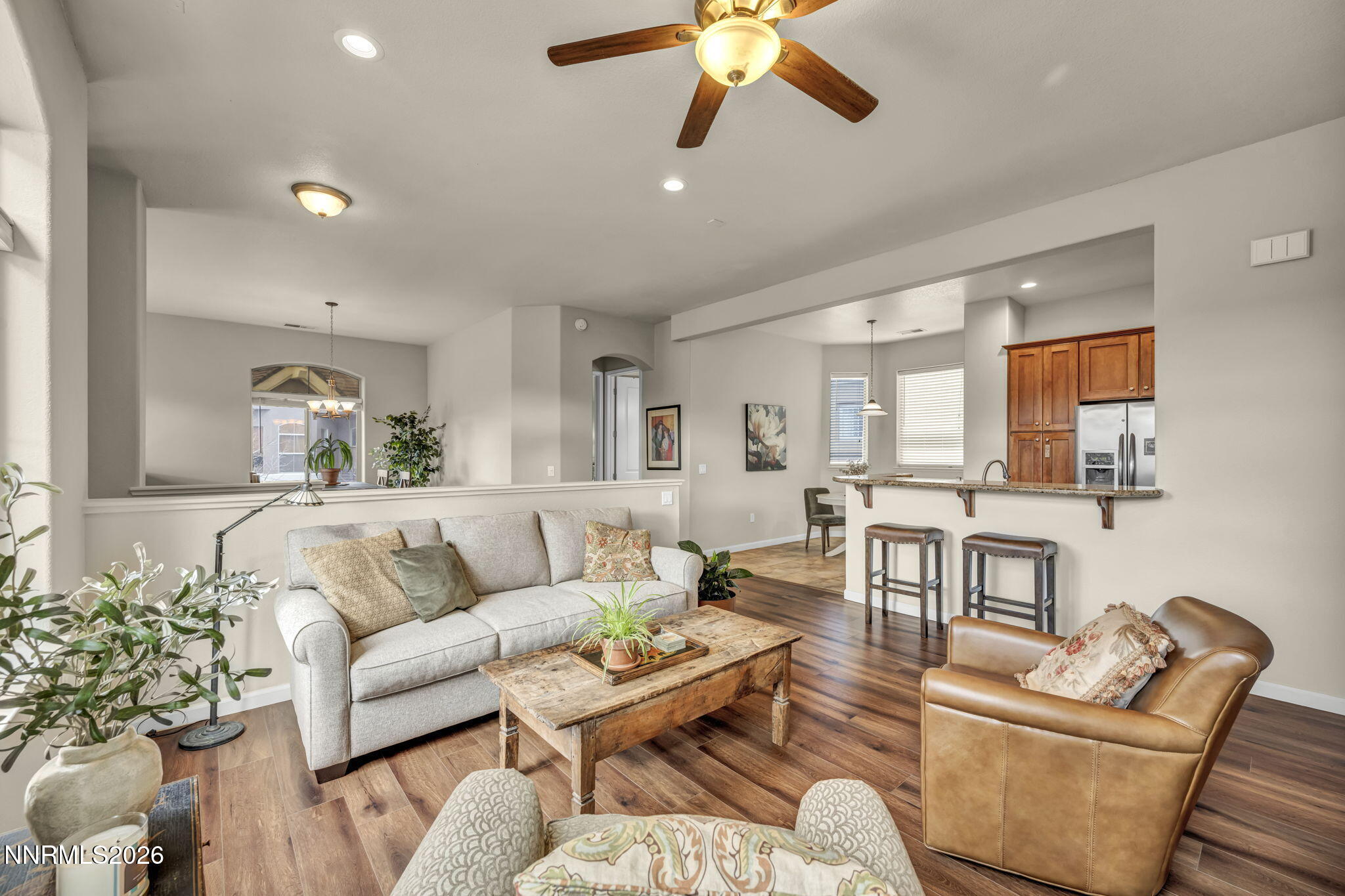 9900 Wilbur May Parkway, Unit 2405 Reno, NV 89521 - Photo 25 of 81 a living room with furniture and a wooden floor