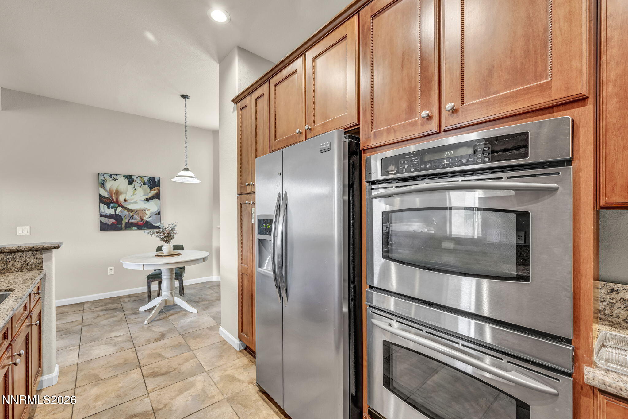 9900 Wilbur May Parkway, Unit 2405 Reno, NV 89521 - Photo 44 of 81 a kitchen with stainless steel appliances a refrigerator and a stove top oven