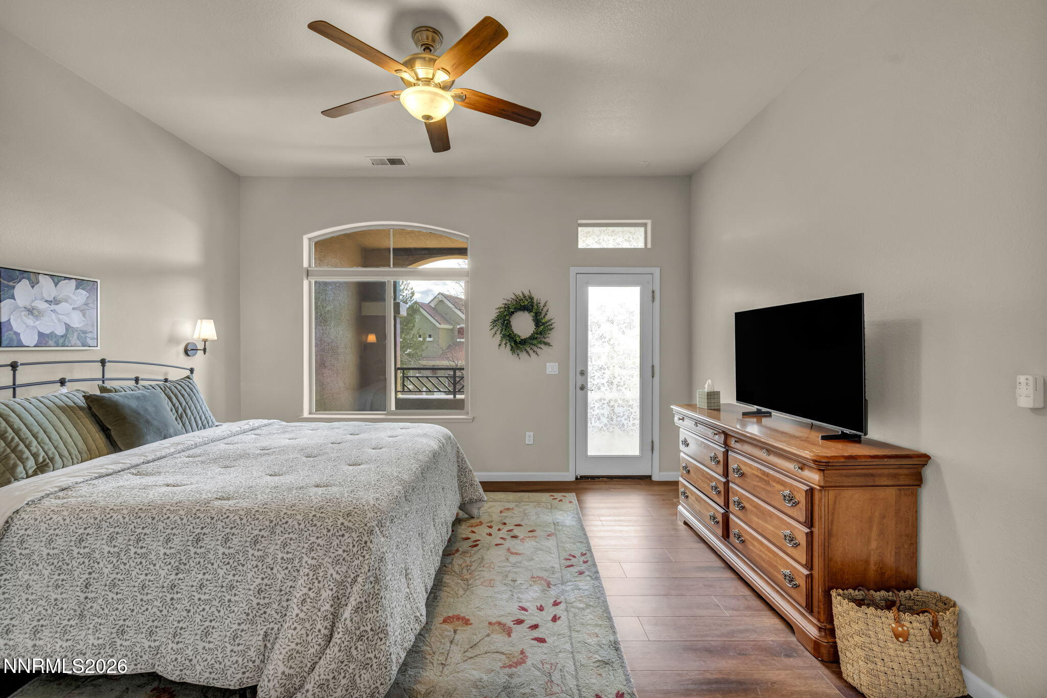 9900 Wilbur May Parkway, Unit 2405 Reno, NV 89521 - Photo 50 of 81 a bedroom with a bed and a flat screen tv