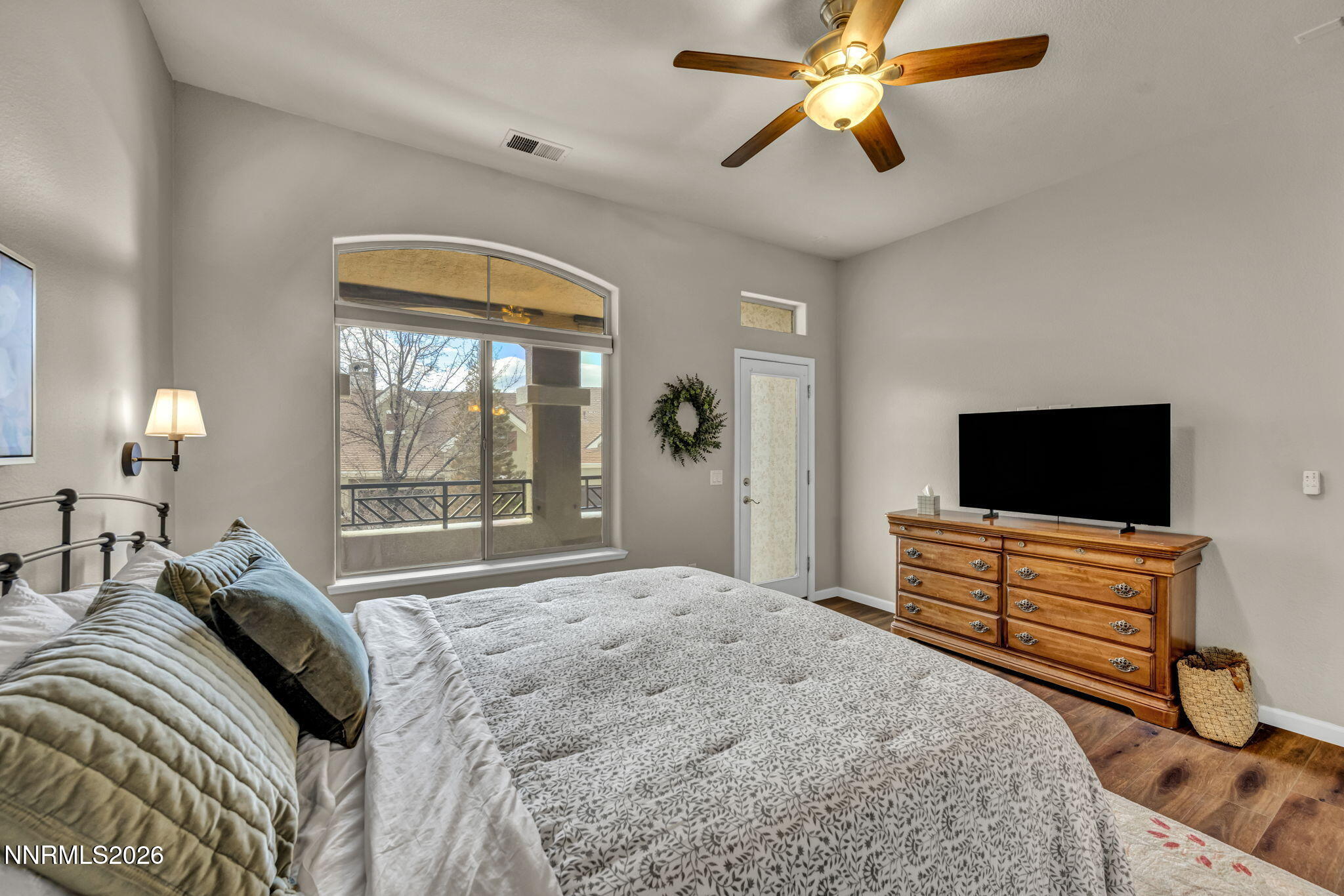 9900 Wilbur May Parkway, Unit 2405 Reno, NV 89521 - Photo 51 of 81 a bedroom with a bed and a flat screen tv