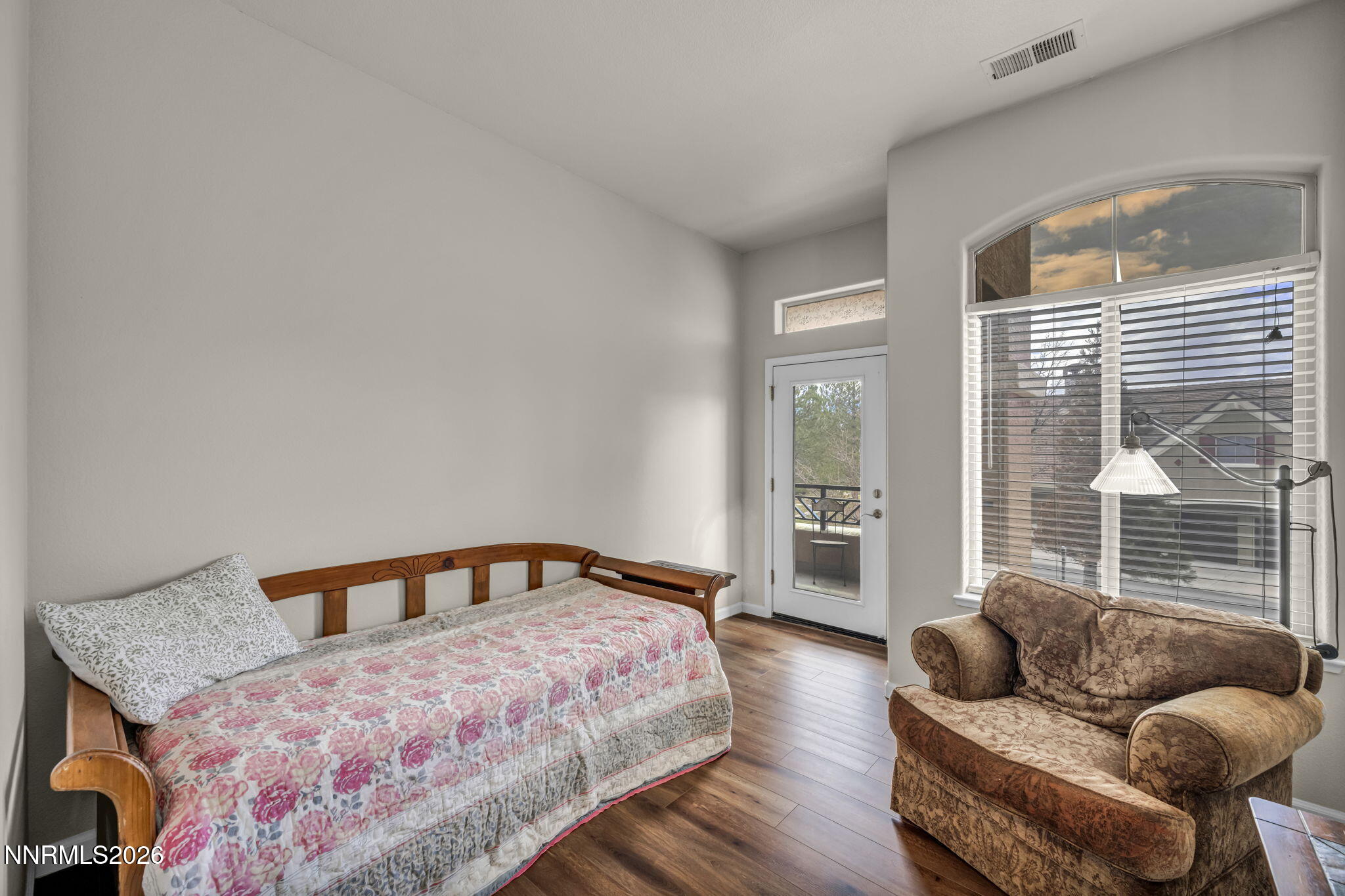 9900 Wilbur May Parkway, Unit 2405 Reno, NV 89521 - Photo 55 of 81 a bedroom with a bed and glass window