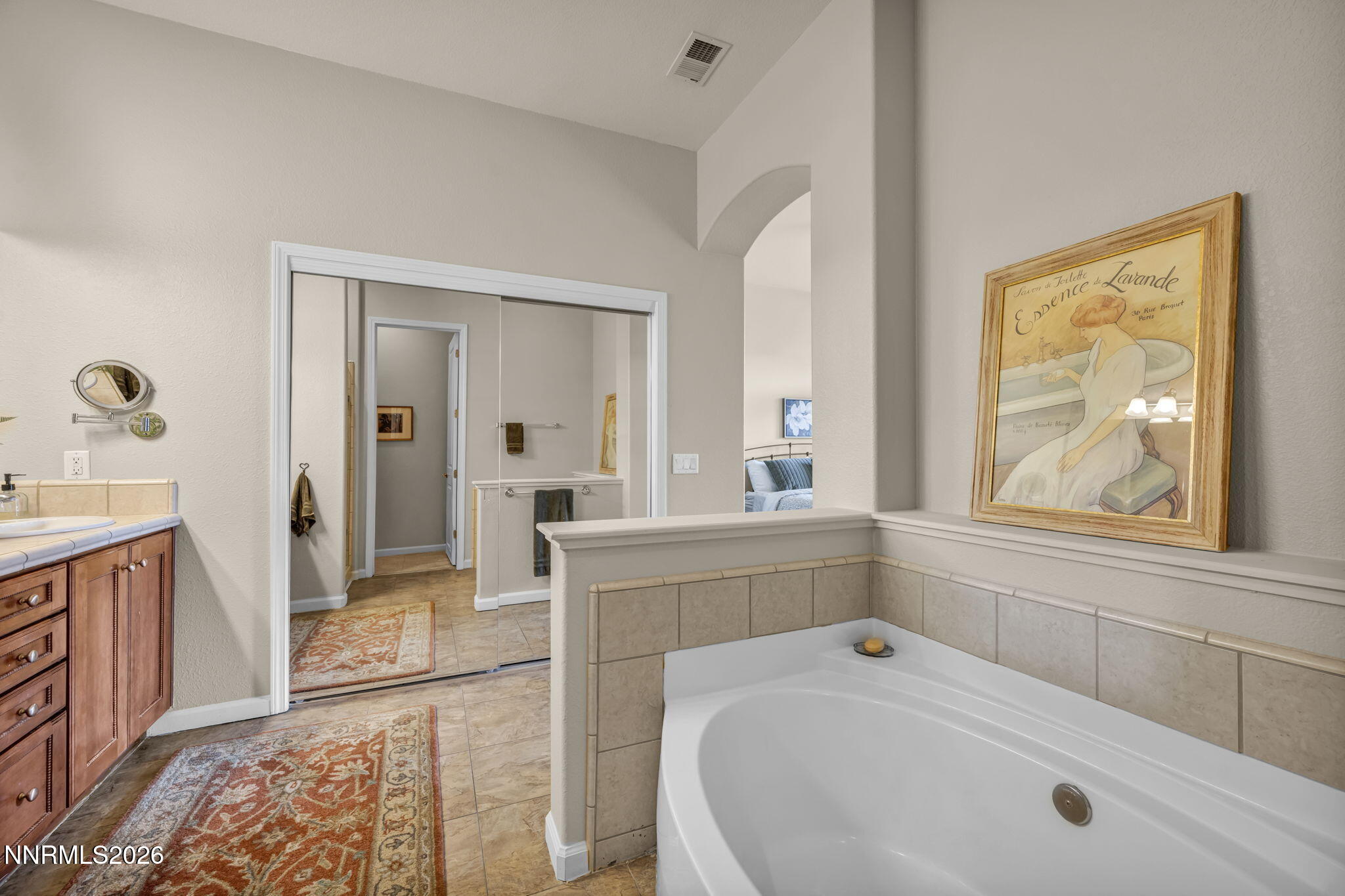 9900 Wilbur May Parkway, Unit 2405 Reno, NV 89521 - Photo 66 of 81 a spacious bathroom with a tub sink and mirror