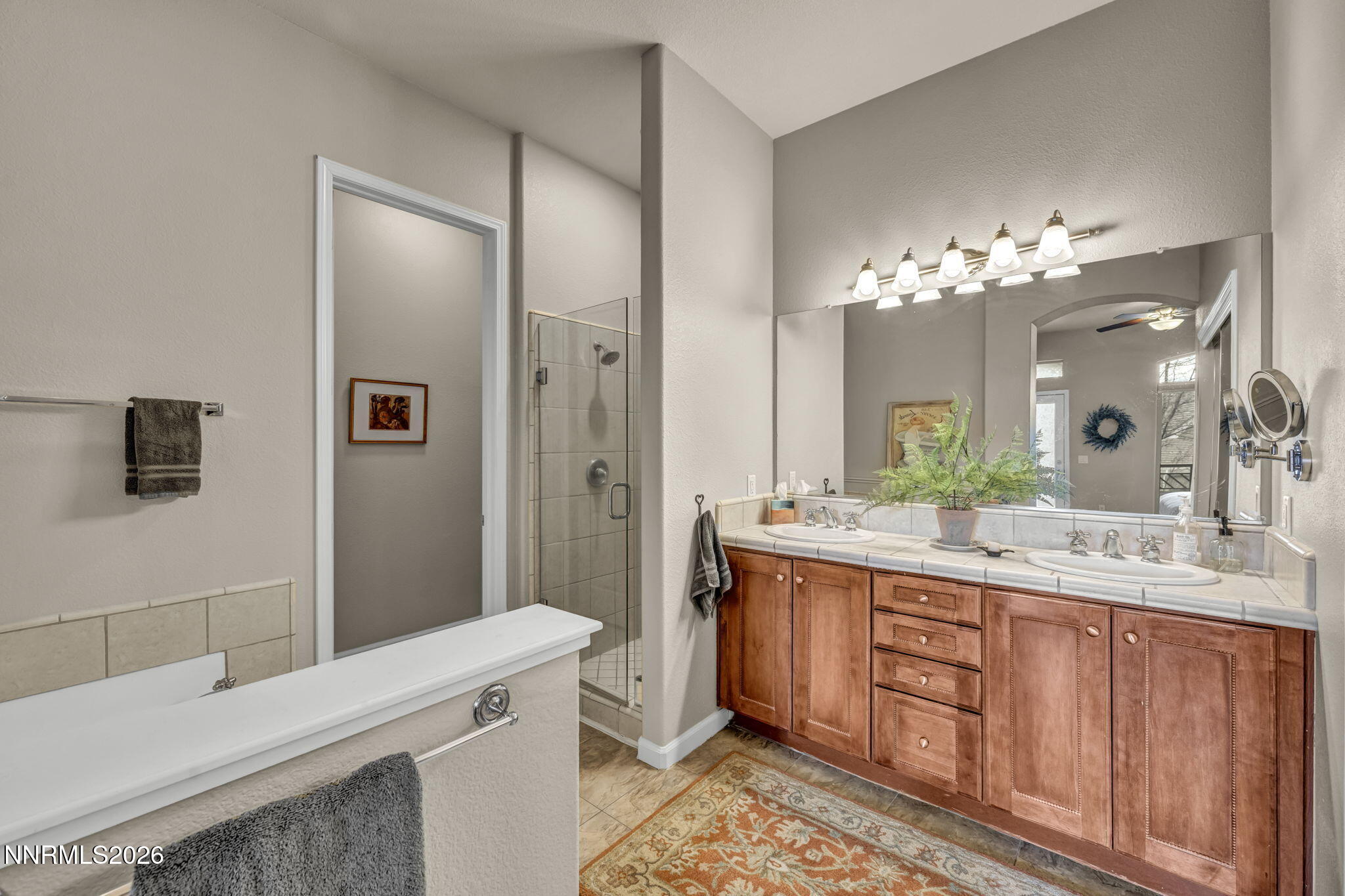 9900 Wilbur May Parkway, Unit 2405 Reno, NV 89521 - Photo 69 of 81 a spacious bathroom with a double vanity sink mirror and shower