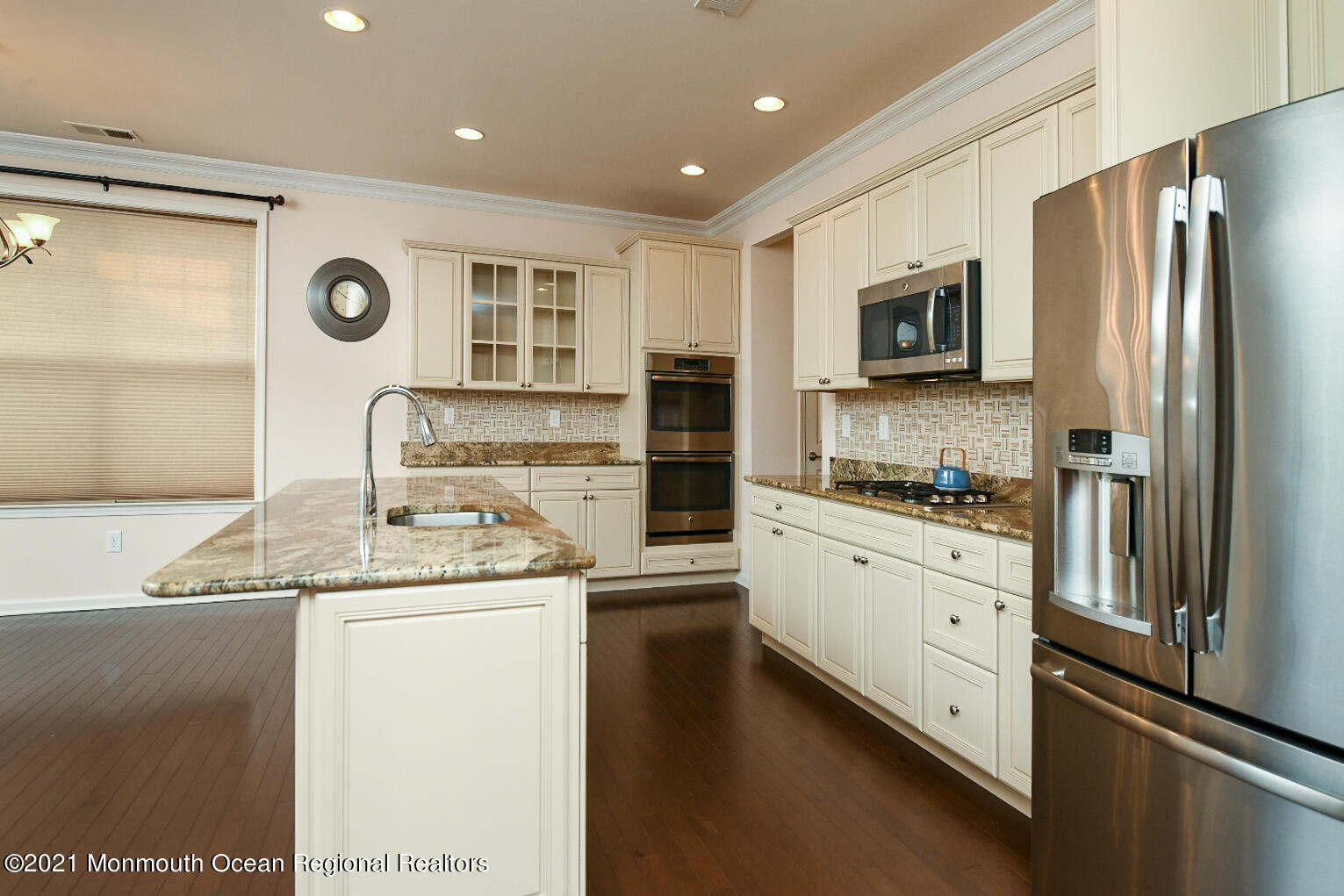 33 Comtois Road Manalapan, NJ 07726 - Photo 12 of 26 a kitchen with stainless steel appliances granite countertop a refrigerator a stove and a sink