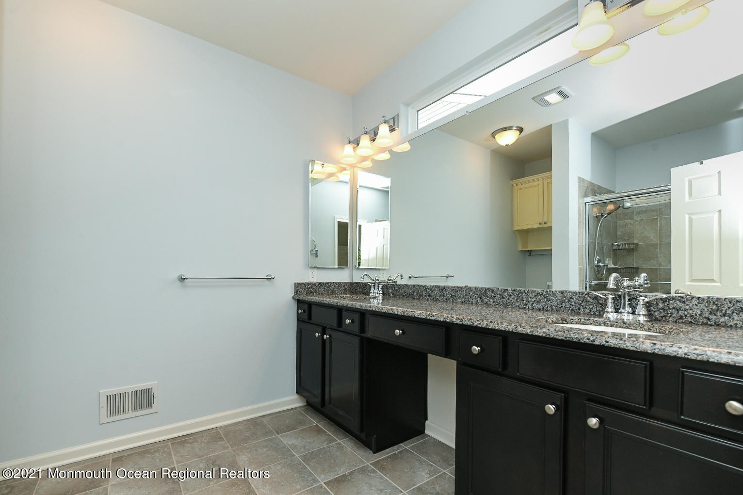 33 Comtois Road Manalapan, NJ 07726 - Photo 18 of 26 a bathroom with a granite countertop sink a large mirror and a
