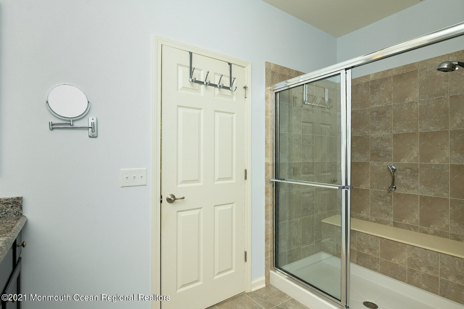 33 Comtois Road Manalapan, NJ 07726 - Photo 19 of 26 a bathroom with a glass shower door