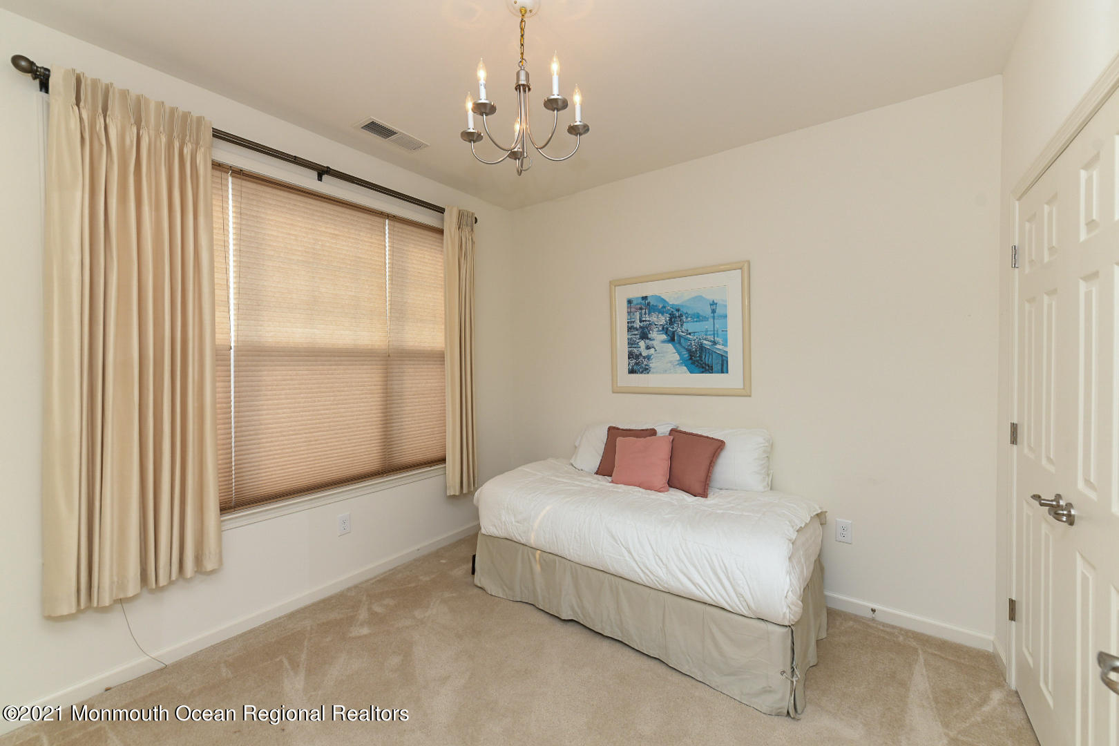 33 Comtois Road Manalapan, NJ 07726 - Photo 21 of 26 a bedroom with a large bed and a chandelier