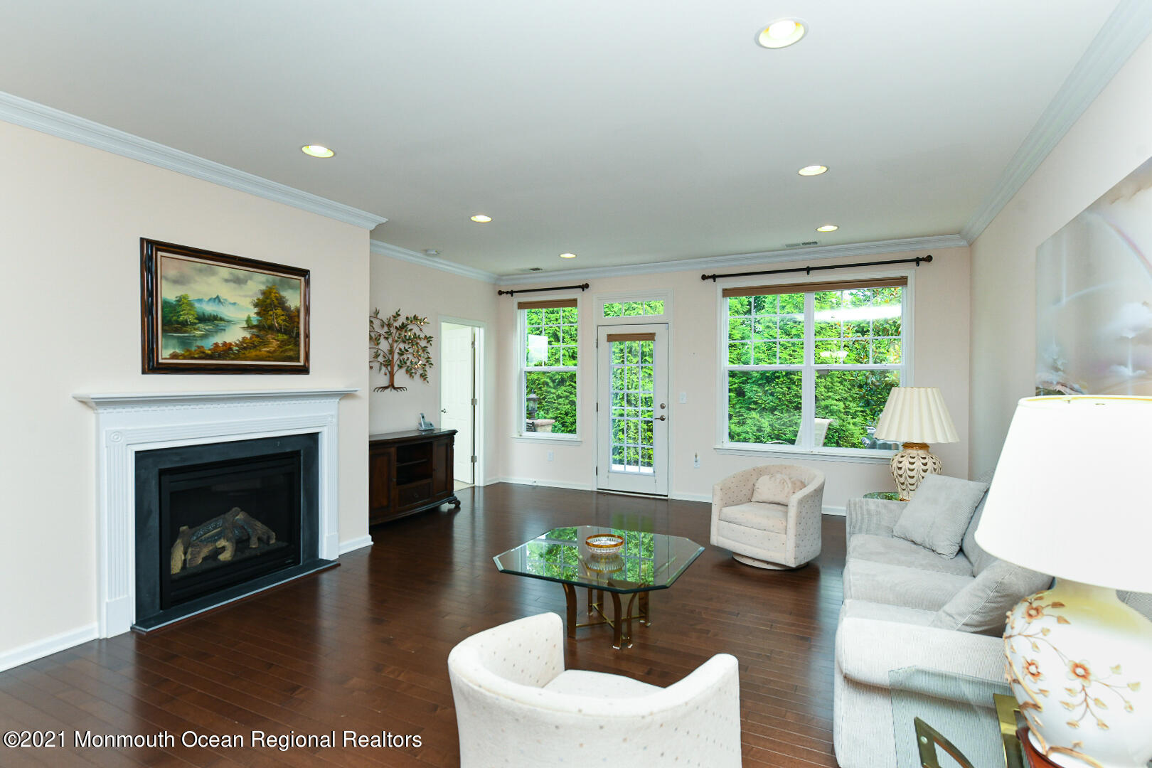 33 Comtois Road Manalapan, NJ 07726 - Photo 6 of 26 a living room with furniture a fireplace and a large window