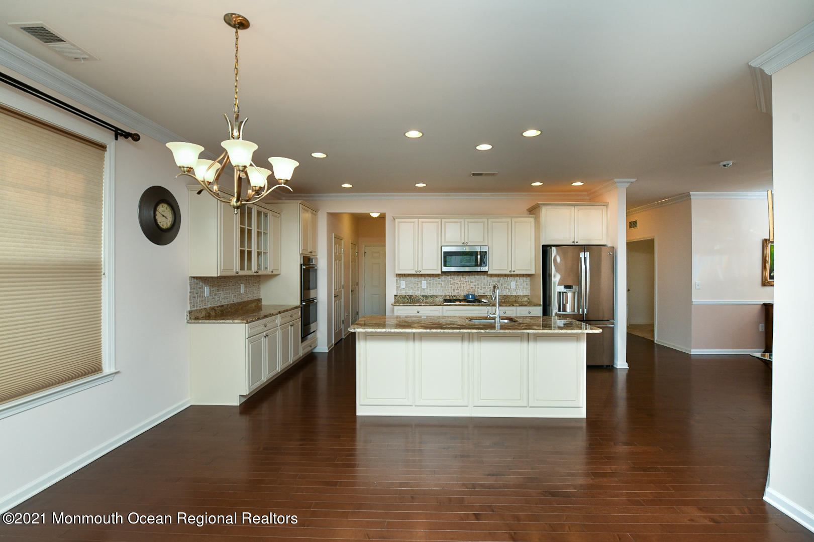 33 Comtois Road Manalapan, NJ 07726 - Photo 10 of 26 a view of a kitchen with a sink stainless steel appliances and cabinets