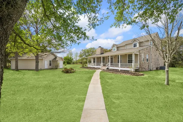 a view of a house with a back yard