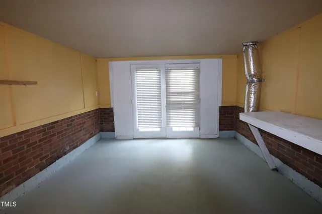 a view of room with window and hardwood