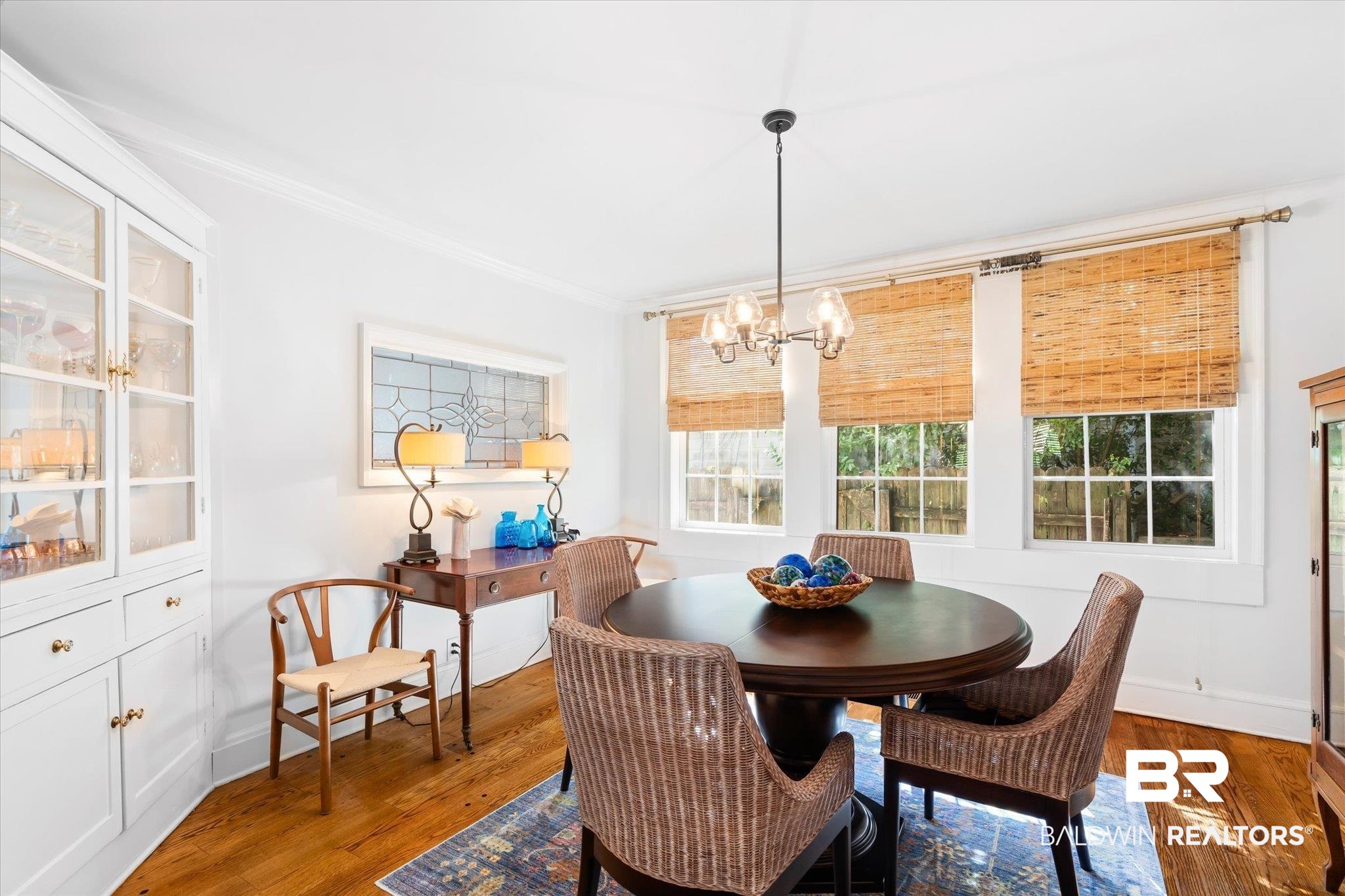 202 Woodlands Avenue Mobile, AL 36607 - Photo 8 of 53 Dining area with dark wood-type flooring, a notable chandelier, and crown molding