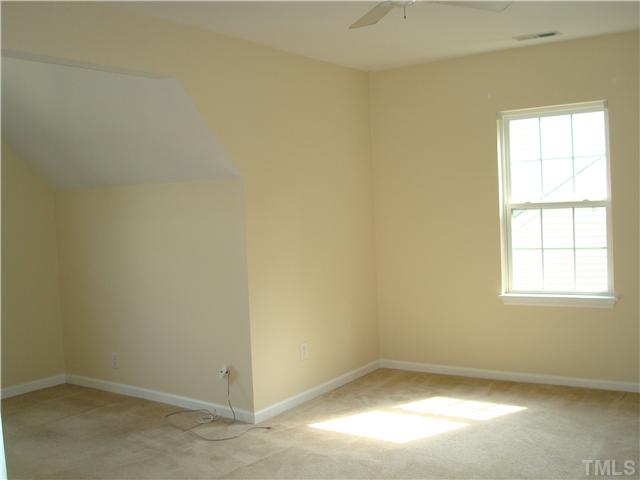 2332 Spruce Shadows Lane Raleigh, NC 27614 - Photo 9 of 11 an empty room with a window