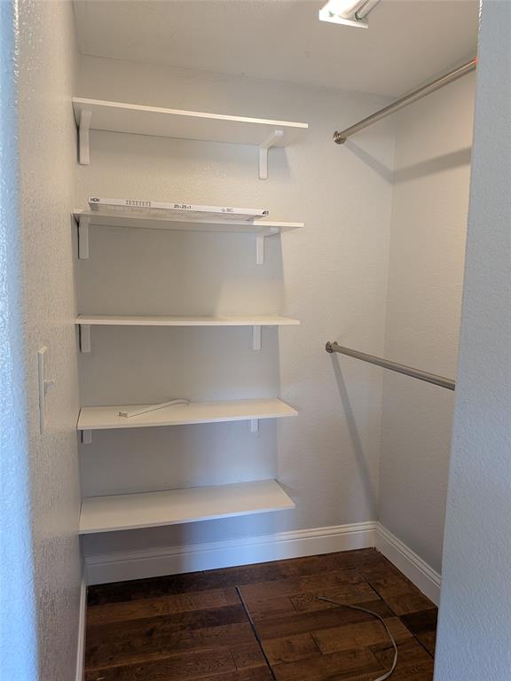 608 Holcomb Road Dallas, TX 75217 - Photo 15 of 23 a view of walk in closet with empty racks
