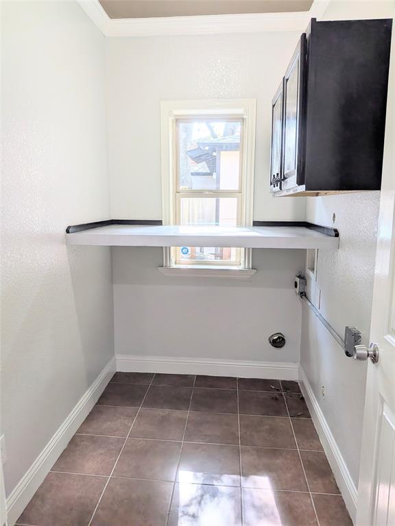 608 Holcomb Road Dallas, TX 75217 - Photo 19 of 23 a view of a kitchen with a sink and a window