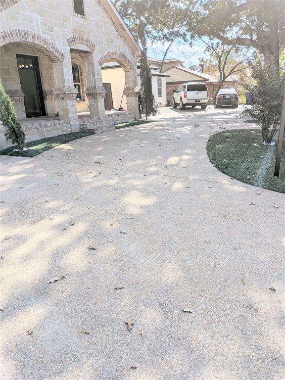 608 Holcomb Road Dallas, TX 75217 - Photo 2 of 23 a view of a house with backyard and road