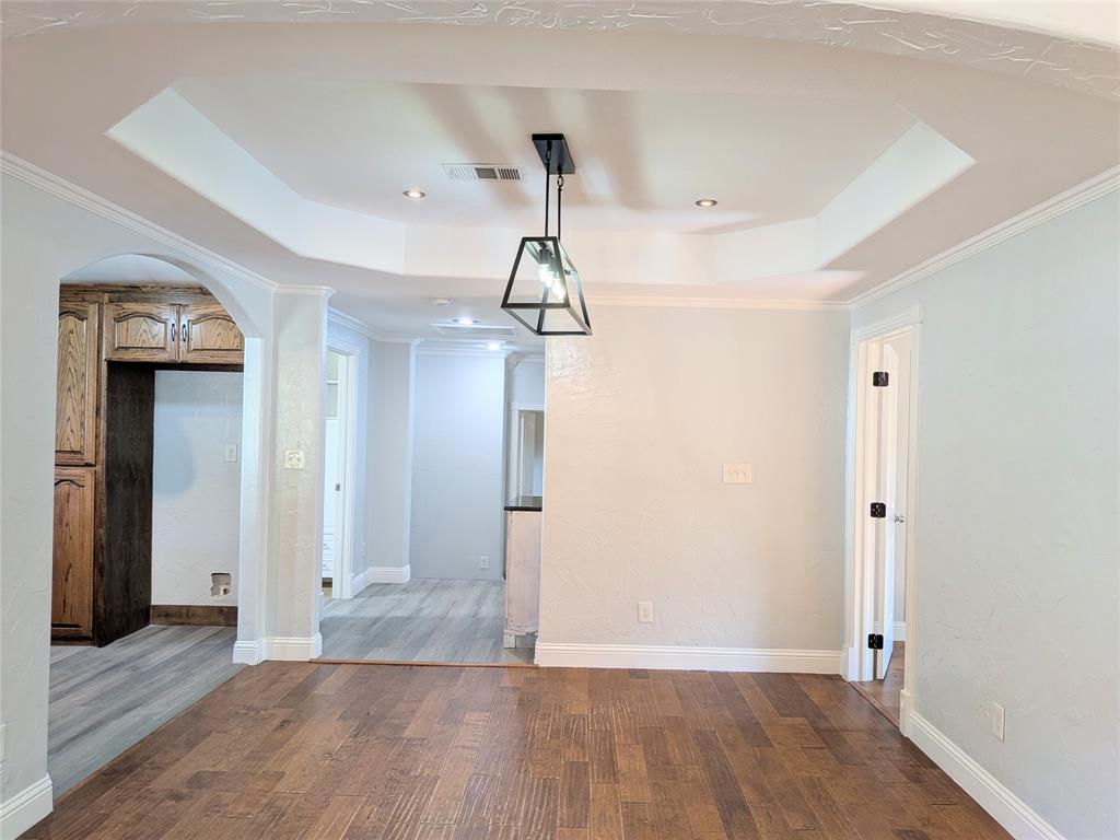 608 Holcomb Road Dallas, TX 75217 - Photo 5 of 23 a view of empty room with wooden floor