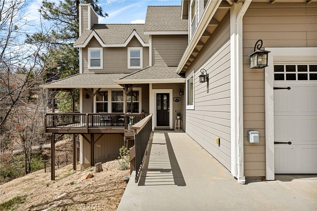 28111 Grenoble Drive Lake Arrowhead, CA 92352 - Photo 11 of 40 a view of a house with wooden floor and a yard