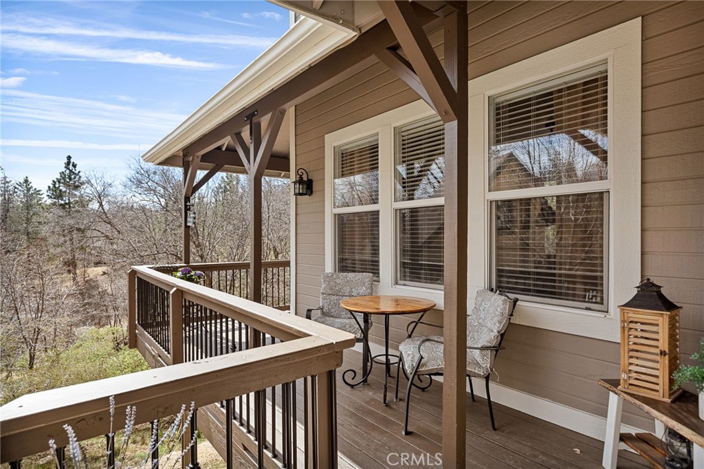 28111 Grenoble Drive Lake Arrowhead, CA 92352 - Photo 12 of 40 a balcony view with a seating space