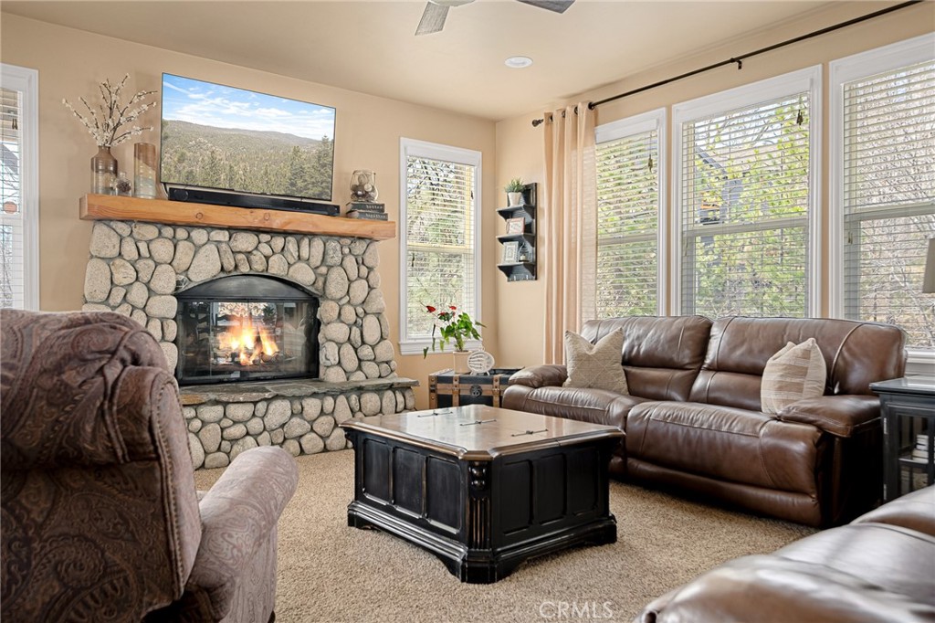 28111 Grenoble Drive Lake Arrowhead, CA 92352 - Photo 13 of 40 a living room with furniture and a fireplace