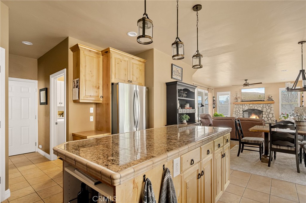 28111 Grenoble Drive Lake Arrowhead, CA 92352 - Photo 18 of 40 a kitchen with stainless steel appliances granite countertop sink stove and refrigerator