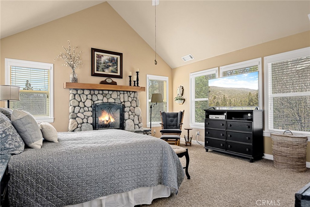 28111 Grenoble Drive Lake Arrowhead, CA 92352 - Photo 23 of 40 a bedroom with a bed and furniture