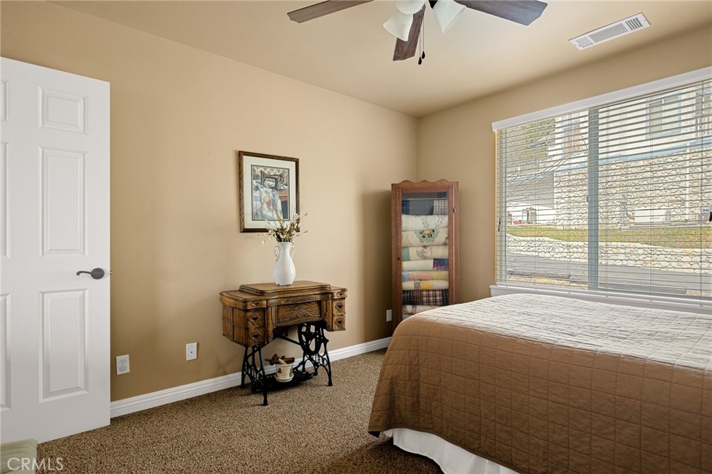 28111 Grenoble Drive Lake Arrowhead, CA 92352 - Photo 30 of 40 a bedroom with a bed and a window