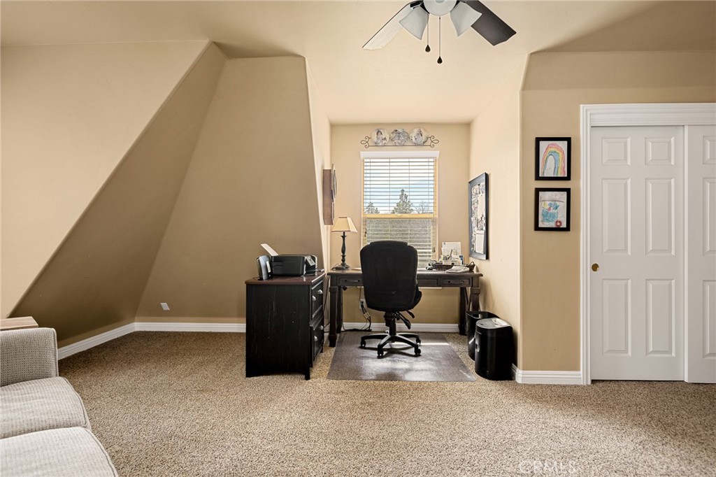 28111 Grenoble Drive Lake Arrowhead, CA 92352 - Photo 31 of 40 a view of a workspace with furniture and a window