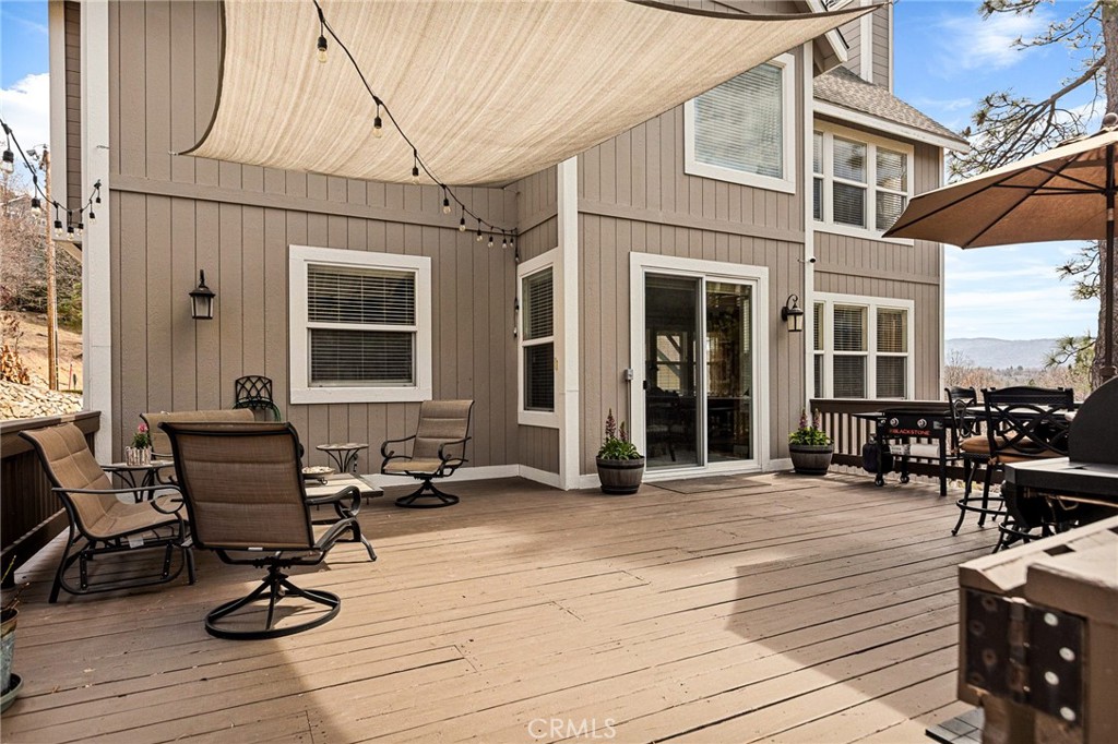 28111 Grenoble Drive Lake Arrowhead, CA 92352 - Photo 34 of 40 a view of a dinning table and chairs in the patio of the house