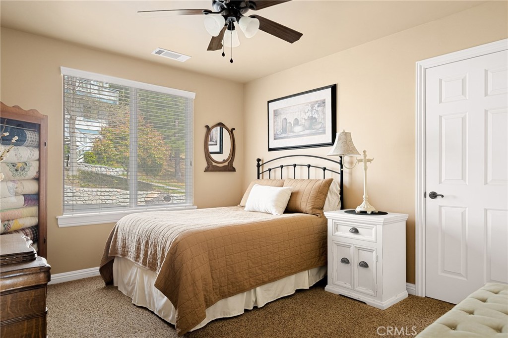 28111 Grenoble Drive Lake Arrowhead, CA 92352 - Photo 8 of 40 a bedroom with a bed and a window