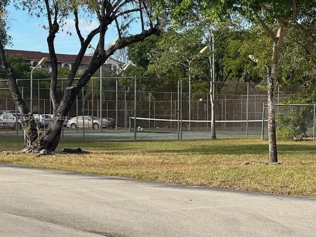 a view of street with parked cars