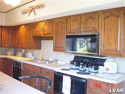 3021 Penn Allen Road Nazareth, PA 18064 - Photo 5 of 8 a kitchen with a sink stove and cabinets