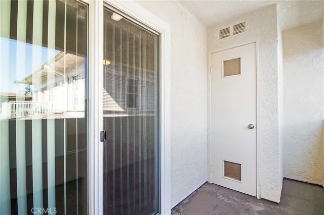a view of a balcony with wooden floor