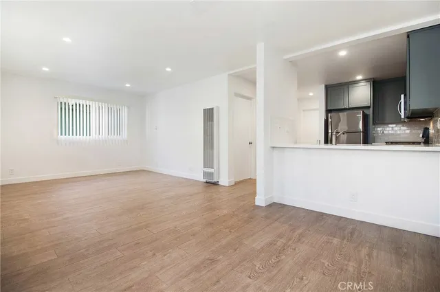 a view of a kitchen cabinets and a wooden floor