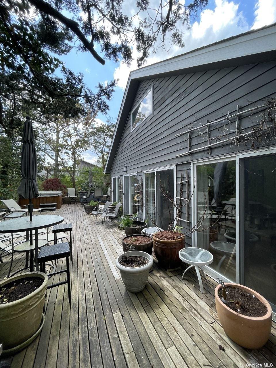 275 Wilmot Road Ocean Beach, NY 11770 - Photo 1 of 19 a view of a patio with chairs and plants
