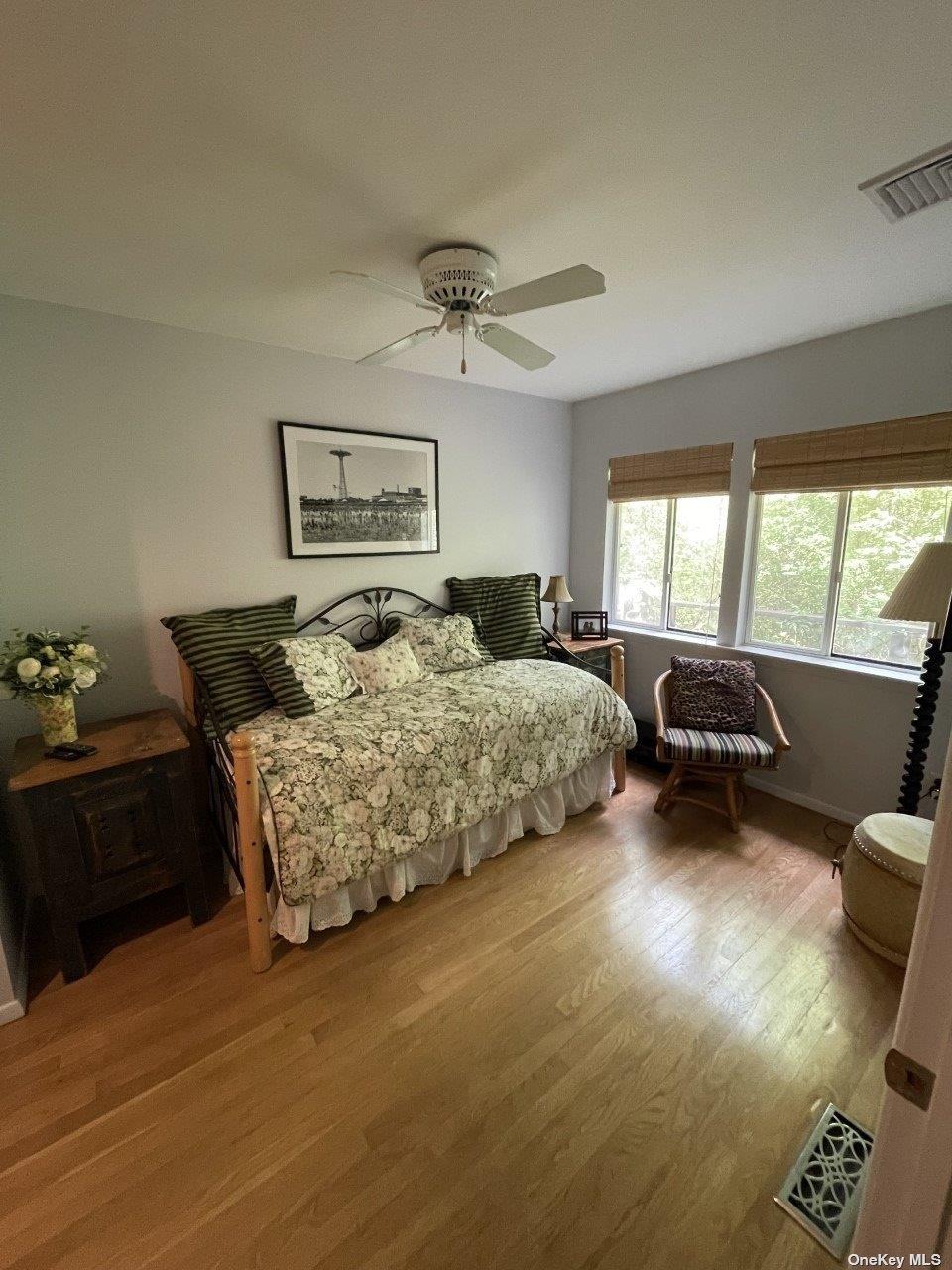 275 Wilmot Road Ocean Beach, NY 11770 - Photo 14 of 19 a bedroom with furniture and a large window