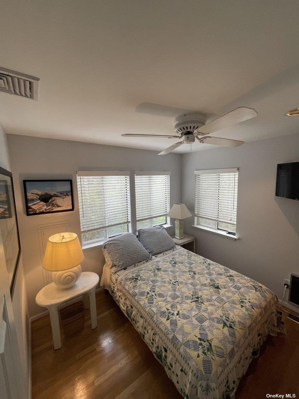275 Wilmot Road Ocean Beach, NY 11770 - Photo 15 of 19 a bedroom with a bed chair and window