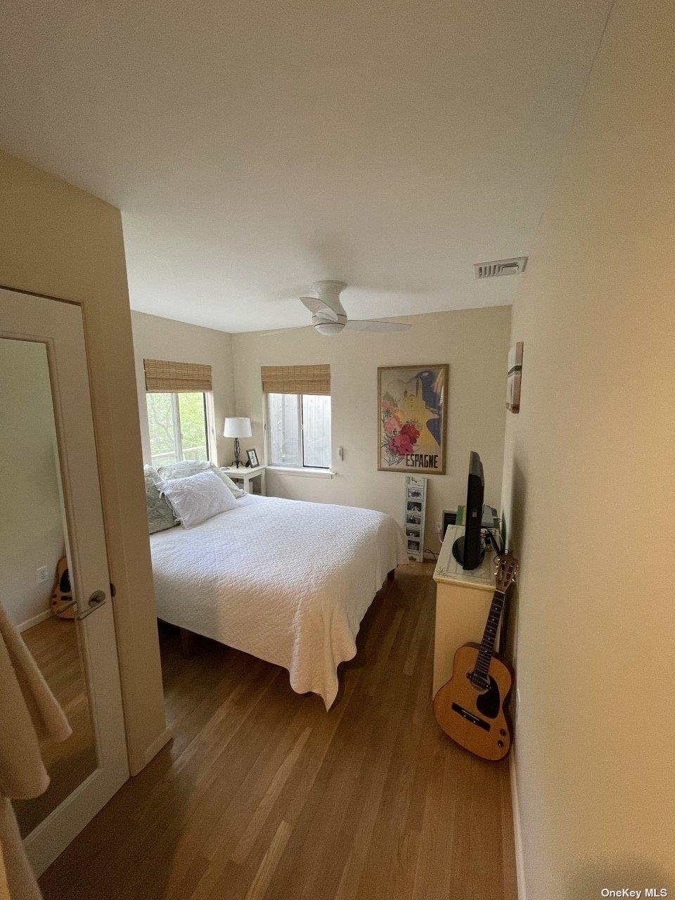 275 Wilmot Road Ocean Beach, NY 11770 - Photo 16 of 19 a bed room with a bed and a tv