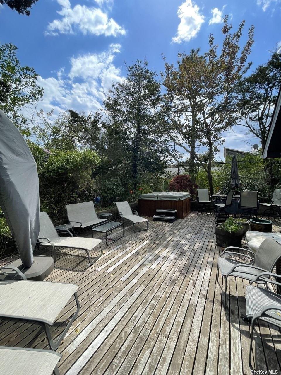 275 Wilmot Road Ocean Beach, NY 11770 - Photo 18 of 19 a view of backyard with seating space
