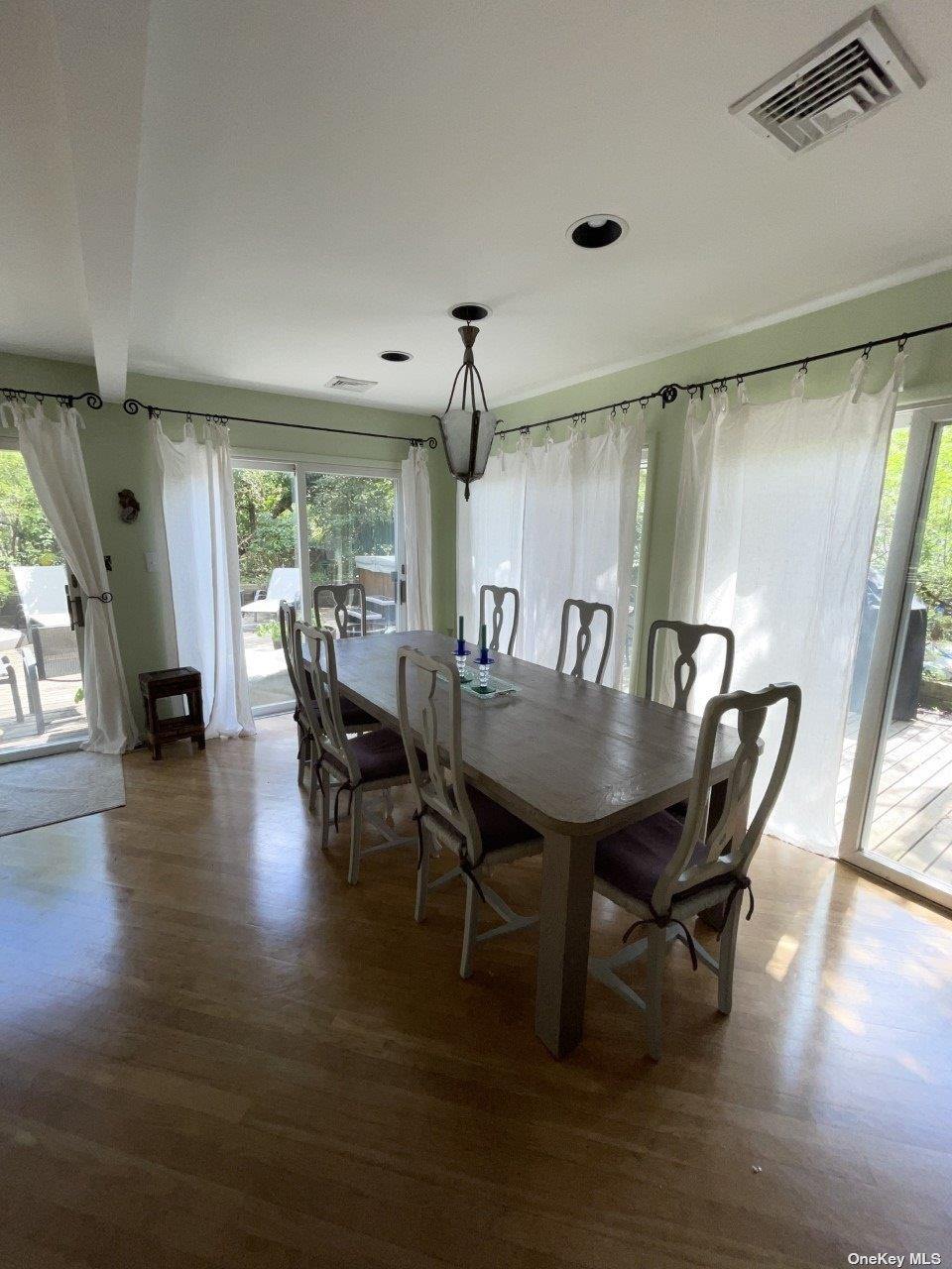 275 Wilmot Road Ocean Beach, NY 11770 - Photo 4 of 19 a view of a dining room with furniture and wooden floor